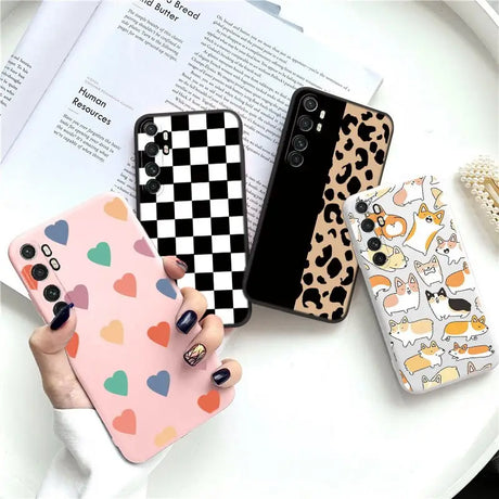 a woman holding a phone case with a cat and dog pattern