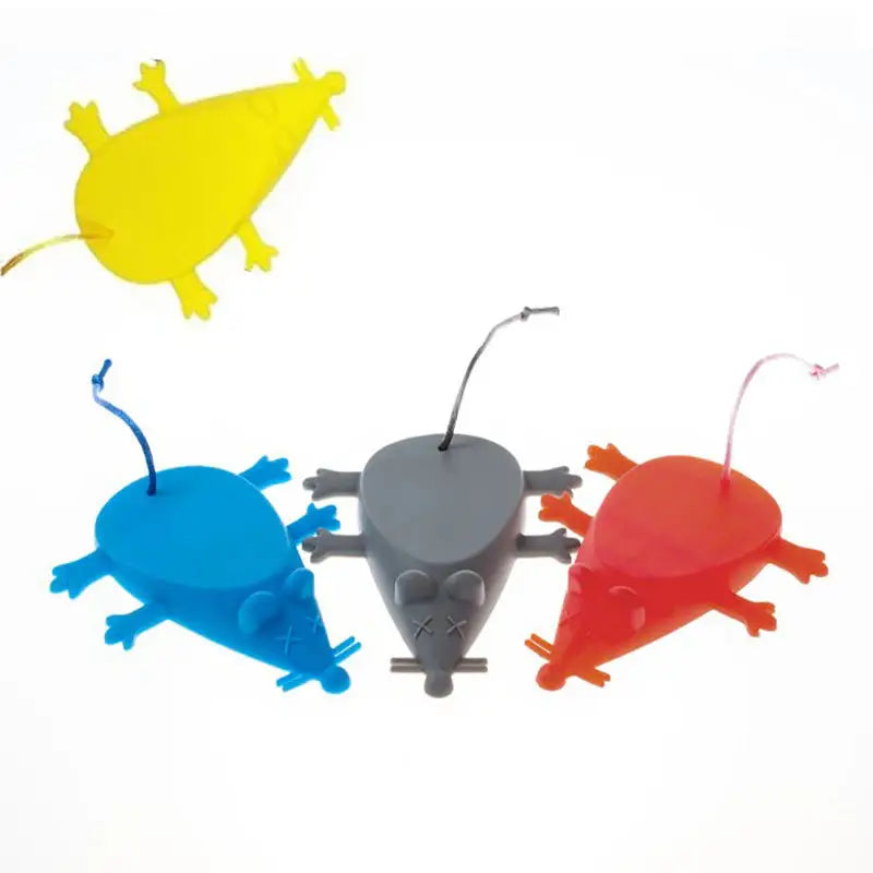 three plastic toy animals are shown in a row