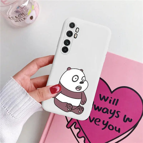 a person holding a phone case with a panda on it