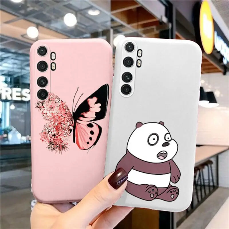 a person holding a phone case with a panda and butterfly on it
