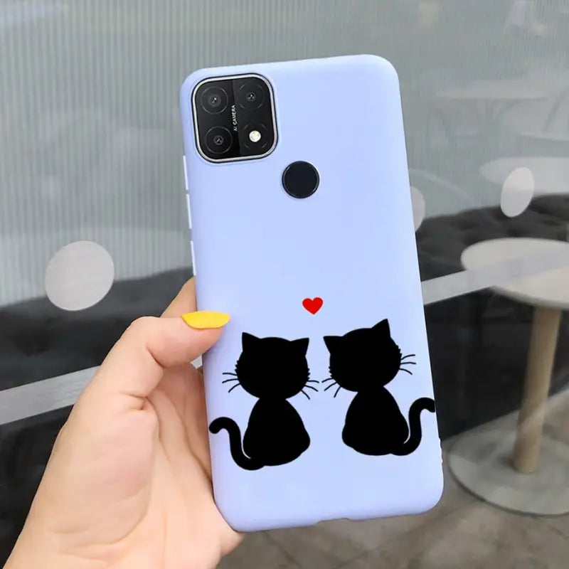 a person holding a phone case with a cat and heart