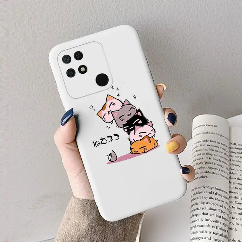 a woman holding a phone case with a cat and dog