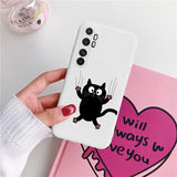 a woman holding a phone case with a black cat on it
