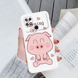 a woman holding a phone case with a cartoon pig