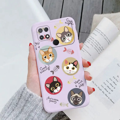 a woman holding a phone case with a cat pattern