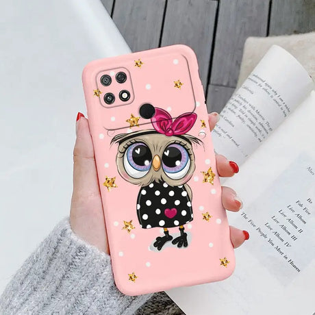 a girl with a bow on her head is holding a pink phone case