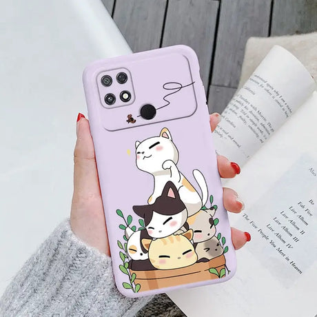 a woman holding a phone case with a cat and dog on it