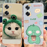 a cat with a green hat and a phone case