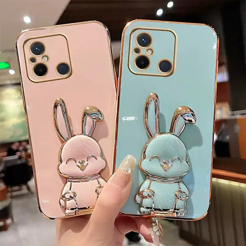 two cute rabbit phone cases with a keychai