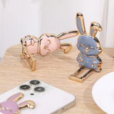 a pair of cute rabbit shaped phone cases