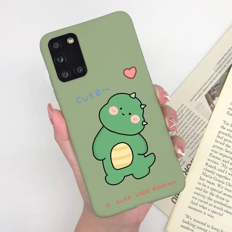 someone holding a phone case with a cartoon dinosaur on it