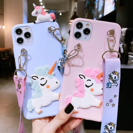 a person holding a phone case with a unicorn and unicorn