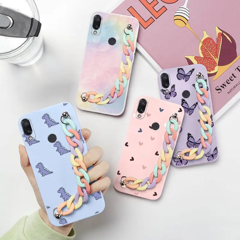 a person holding a phone case with a colorful pattern