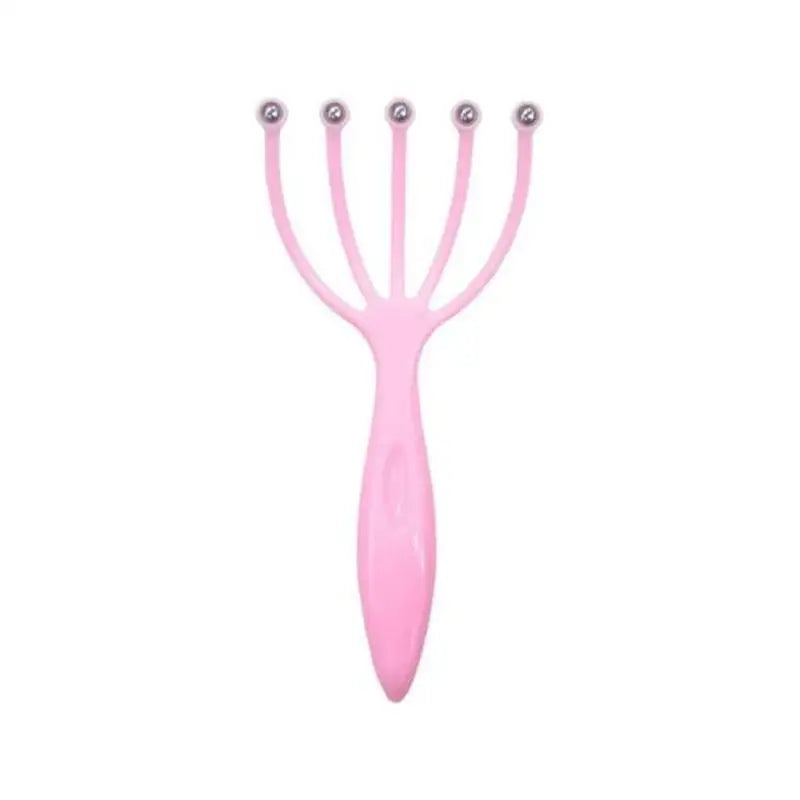 a pink plastic hair brush with two eyes