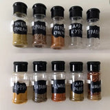 a shelf with bottles filled with spices