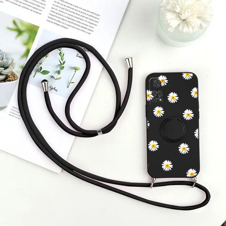 there is a phone case with a camera strap attached to it