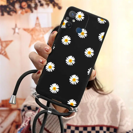 there is a woman holding a phone with a daisy pattern on it