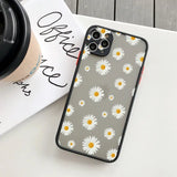 daisy iphone case with a coffee cup on a table