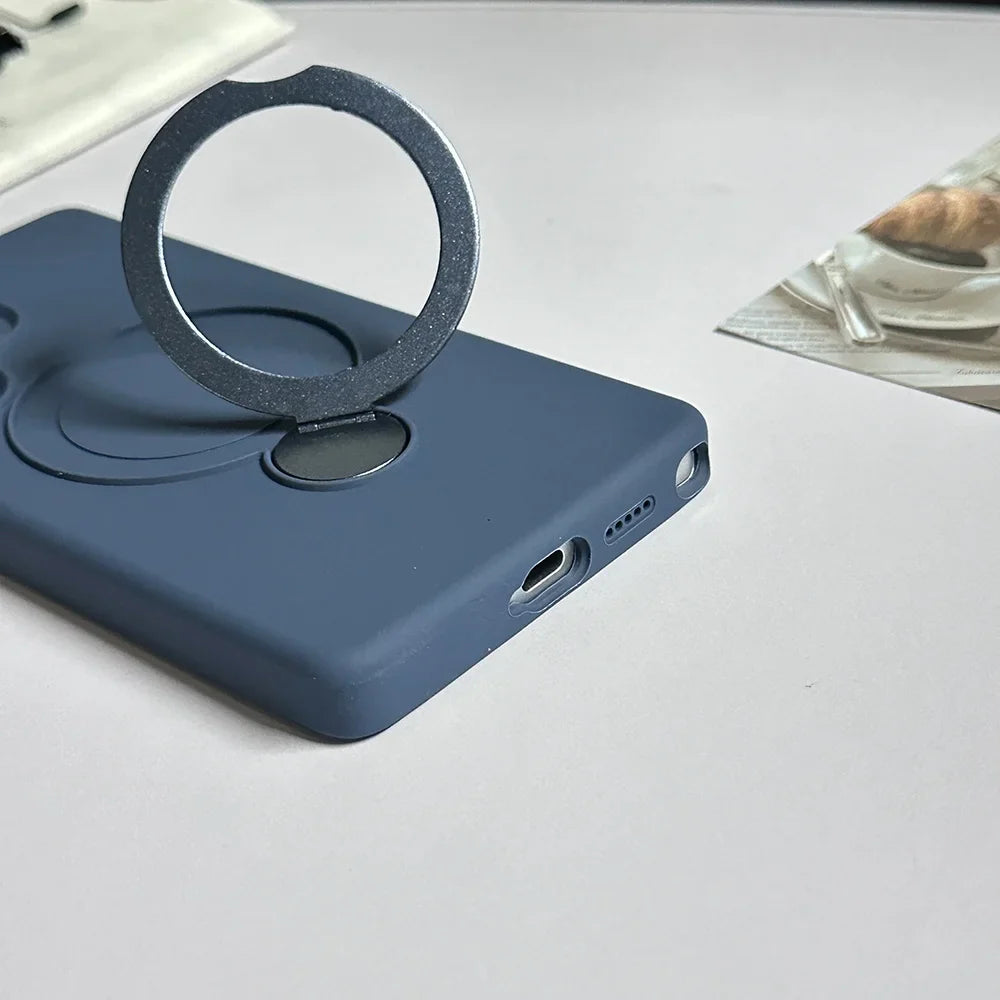 A dark blue phone case with a silver, circular, magnetic ring holder.