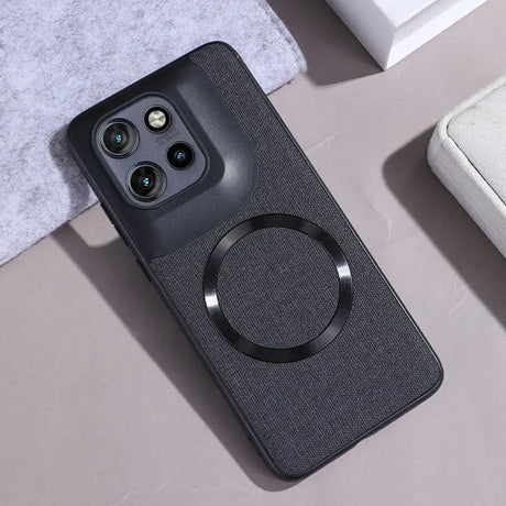 Dark gray fabric-textured phone case with a raised camera module and an embedded black magnetic ring.