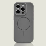 A dark gray silicone phone case with a camera cutout and a circular magnetic charging ring.