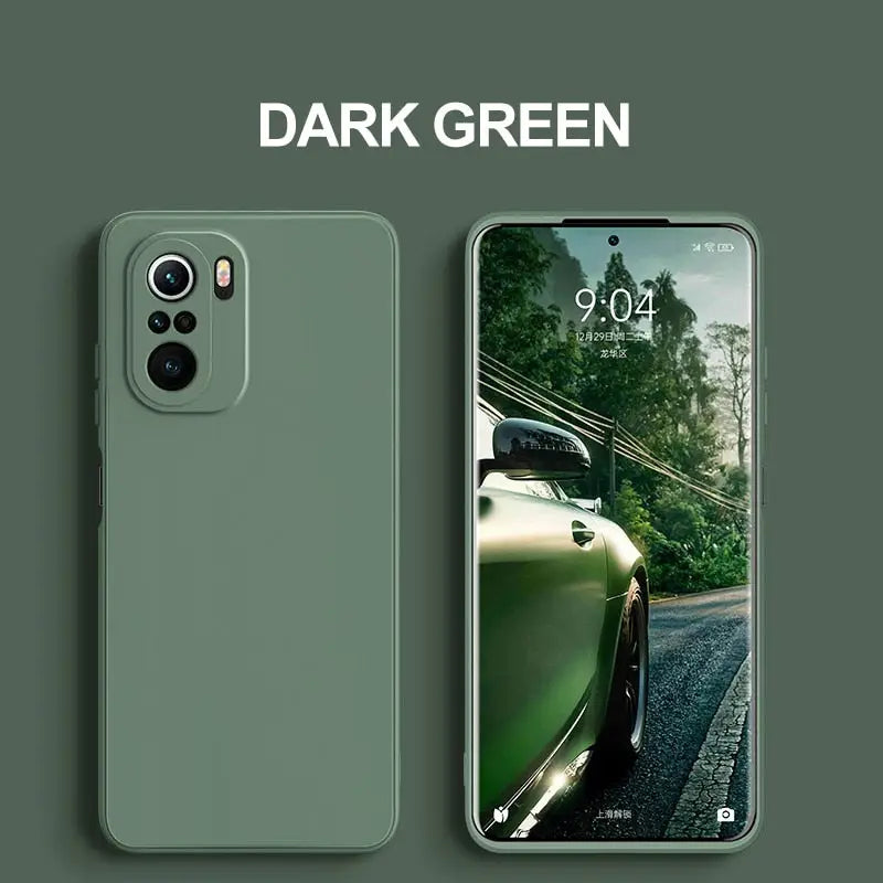 a green phone with a dark green screen next to a green car
