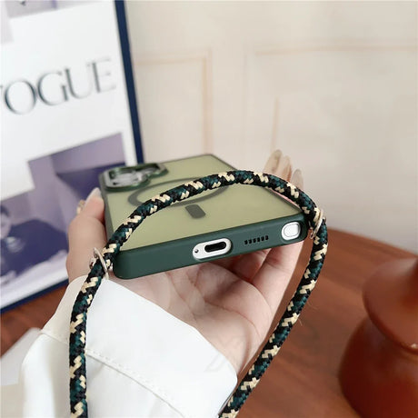 Dark green phone case with a translucent back and a woven strap.