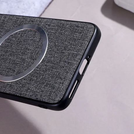 A dark grey fabric-textured phone case with a silver magnetic ring.