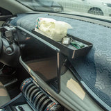 a car dashboard with a cup holder in the center