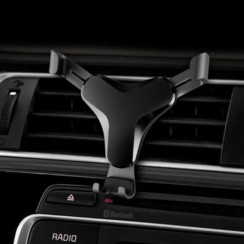 the car dashboard with the air vent and dashboard mount