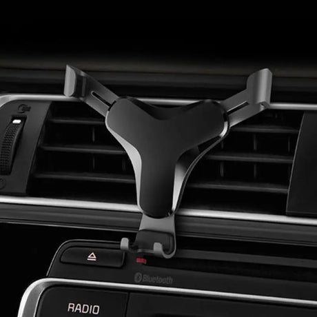 the car dashboard with the air vent and dashboard mount