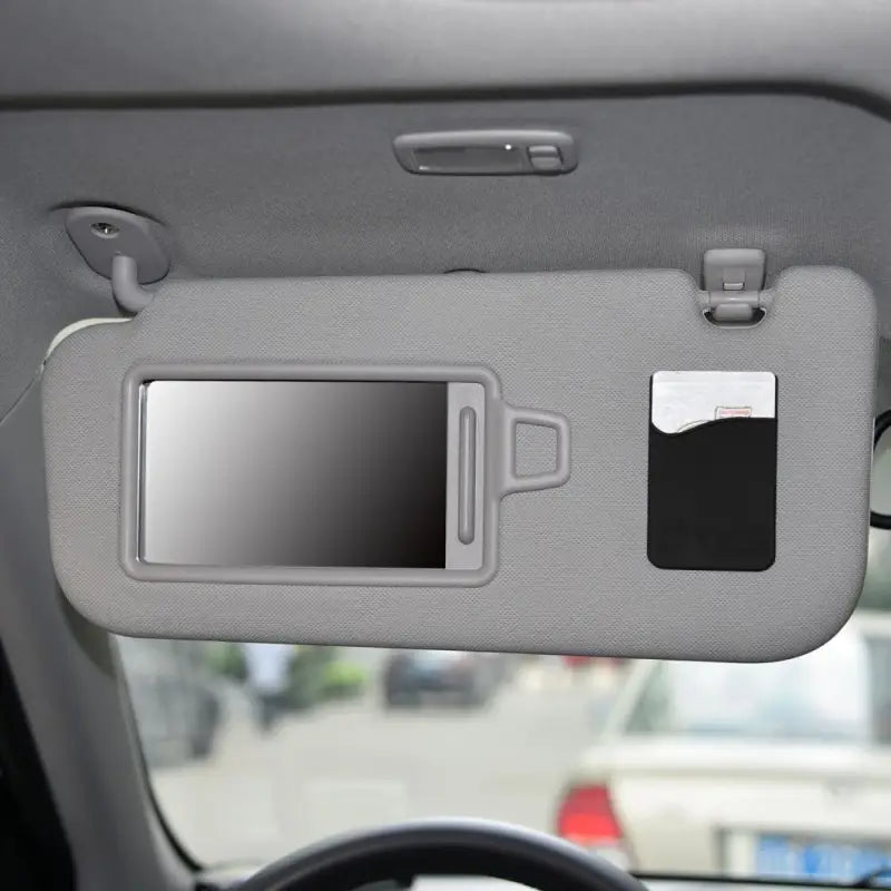 the car dashboard with a phone holder attached to it