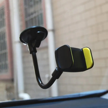a car dashboard with a yellow and black car mirror