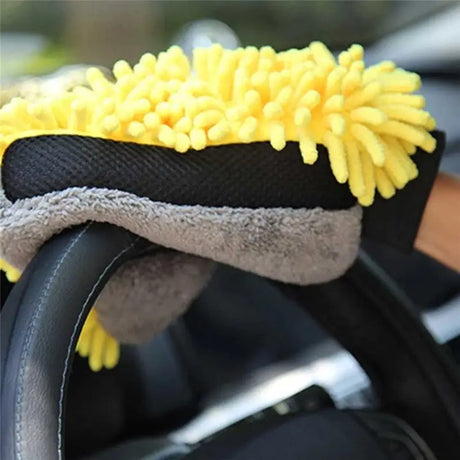 a car dashboard with a yellow sponge on it