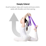 a woman doing yoga with a purple ribbon