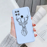 a woman holding a phone case with a deer head on it