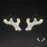 a pair of reindeer head stud earrings with rhine