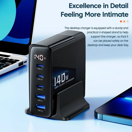 Desktop charger with multiple USB ports and a digital display showing 140W output.