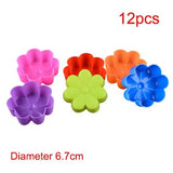 a set of six flower shaped plastic cake pans