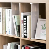 a book shelf with books and a plant