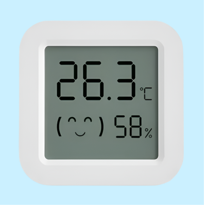 Digital thermometer and hygrometer display showing temperature and humidity.