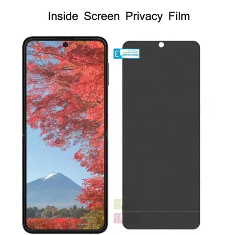 a black phone with a screen and a red tree