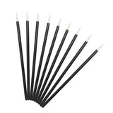 a set of six black and white paint brushes with white tips