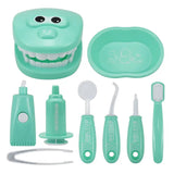 a close up of a toothbrush, toothpaste, toothbrush holder, and other items