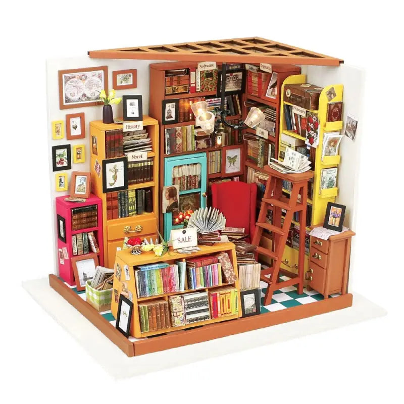a doll house with books and pictures on the walls