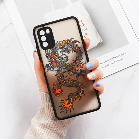 a woman holding a phone case with a dragon design