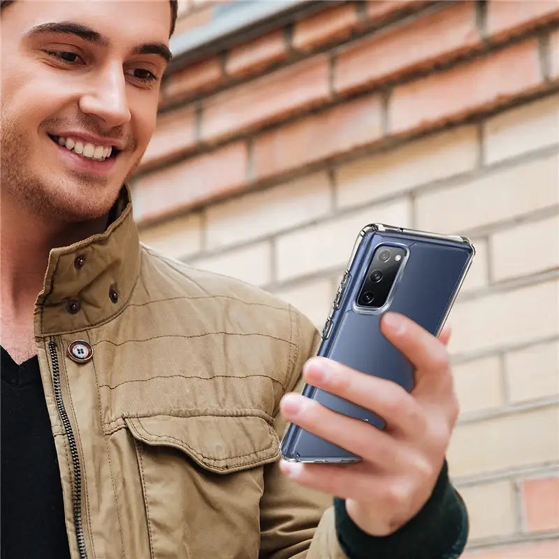 a man in a jacket holding a cell phone
