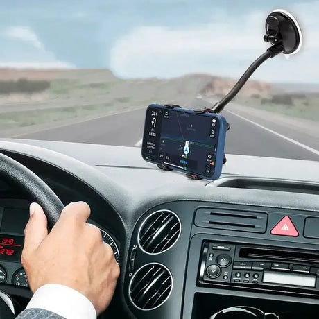 a man driving a car with a gps device