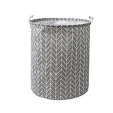 the grey and white geometric pattern on this laundry basket is perfect for a small bathroom or bedroom