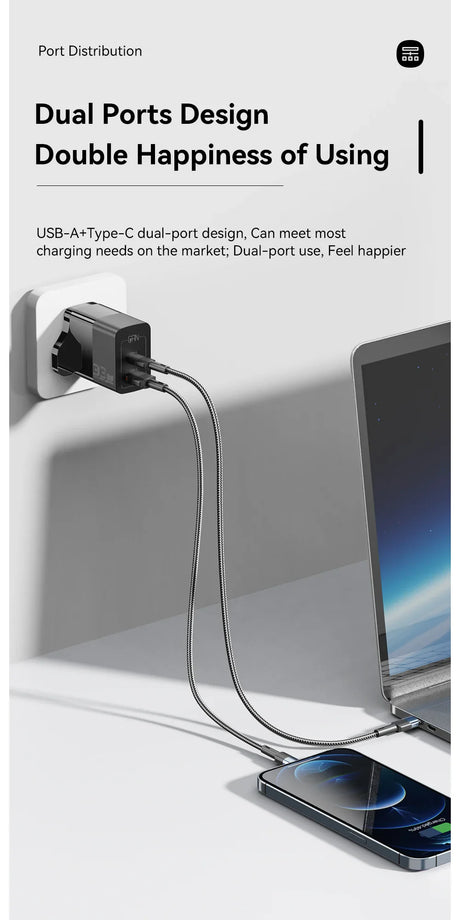 Dual-port USB charger plugged into a wall outlet, charging a laptop and smartphone simultaneously.